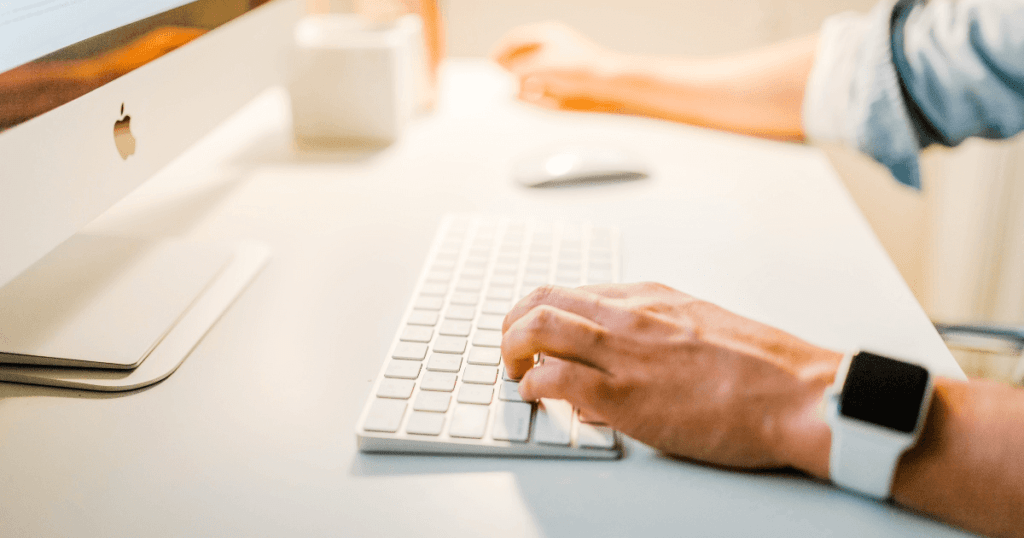 Keyword Research - a closeup picture of a person writing on a keyboard 