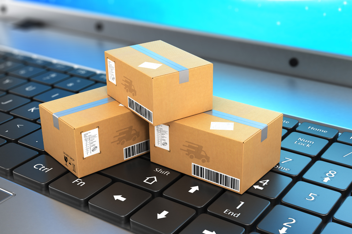 Best Shopify Shipping Apps: 2025 Top Picks on Shopify App Store 1 Shipped packages on top of a keyboard - Best Shopify Shipping Apps